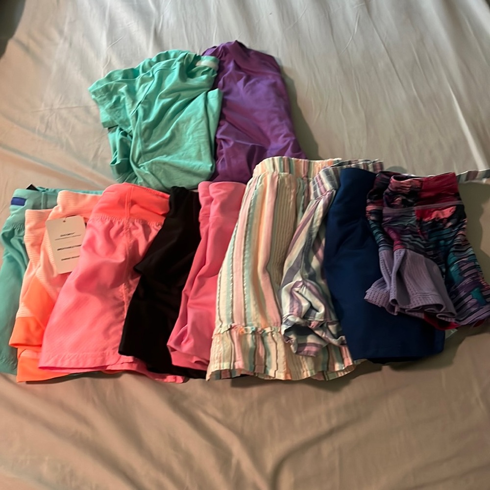 Bundle of 11 shirts, skirts, and shorts, size 5/6(x)